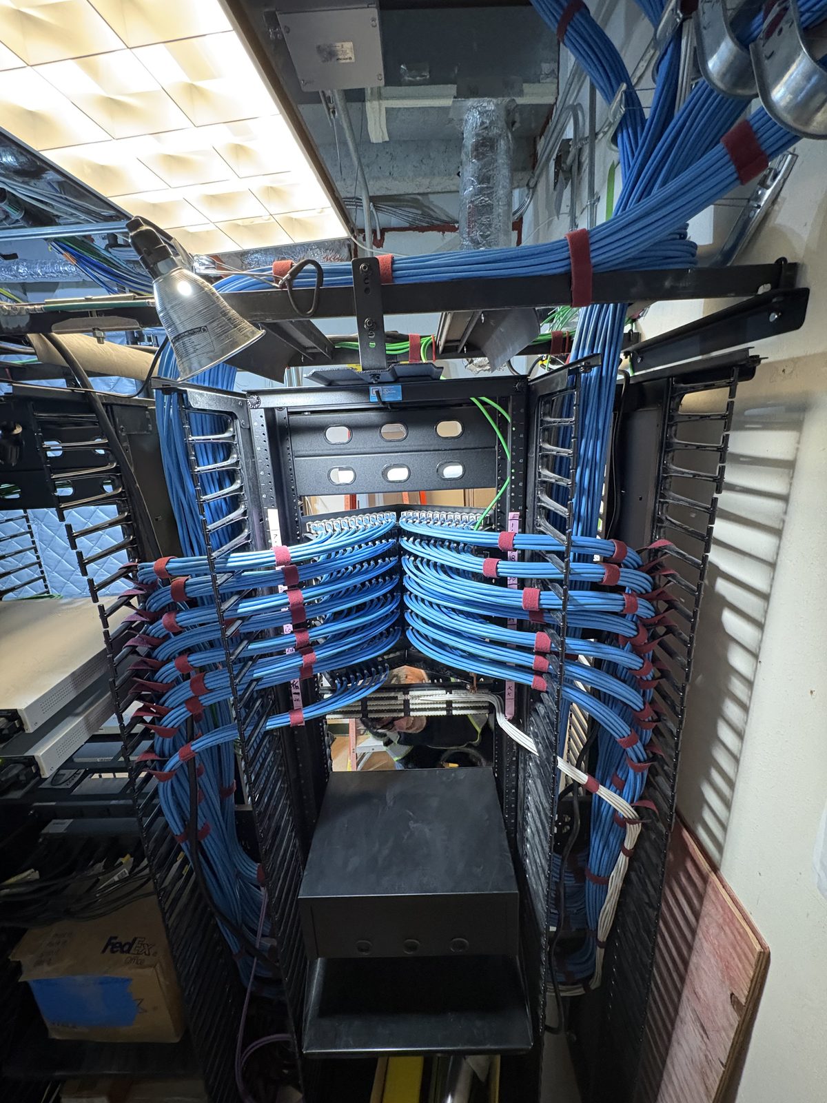 Back-of-rack cable management with velcro-bundled runs