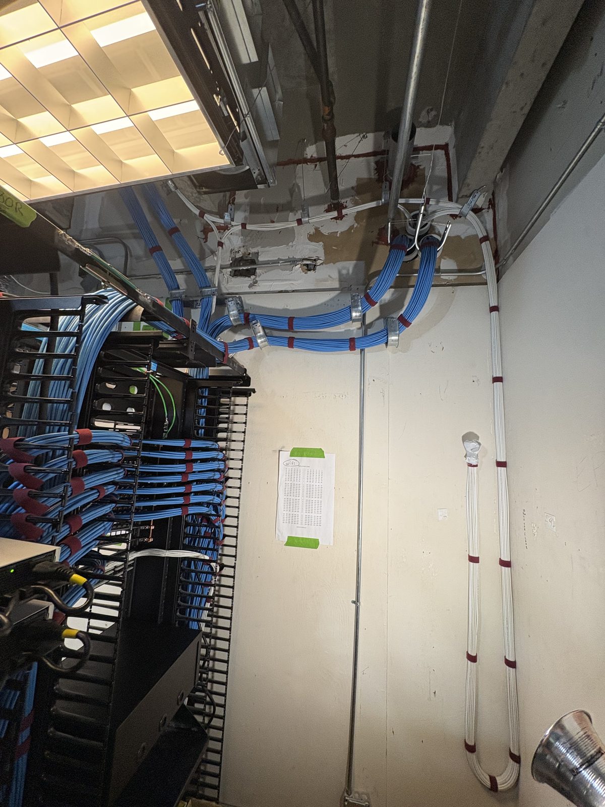 Tidy overhead Cat6 pathway feeding the new rack